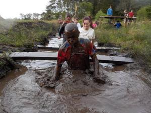 Practitoners tackle assault course for charity 